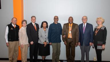 Georgetown alums pose with Dr. Roger Ward, Professor of Philosophy.